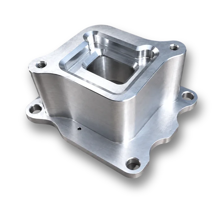 Machined flanged housing with a stepped rectangular pocket, threaded holes and a mounting flange